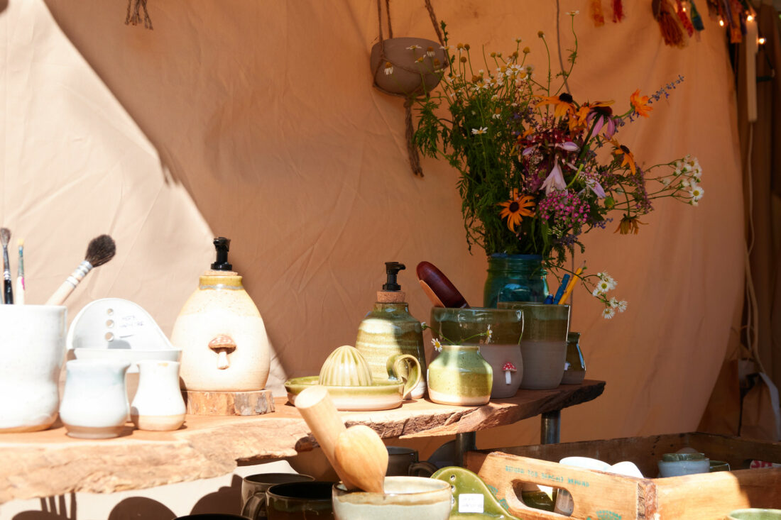 Craft vendor table with pottery items