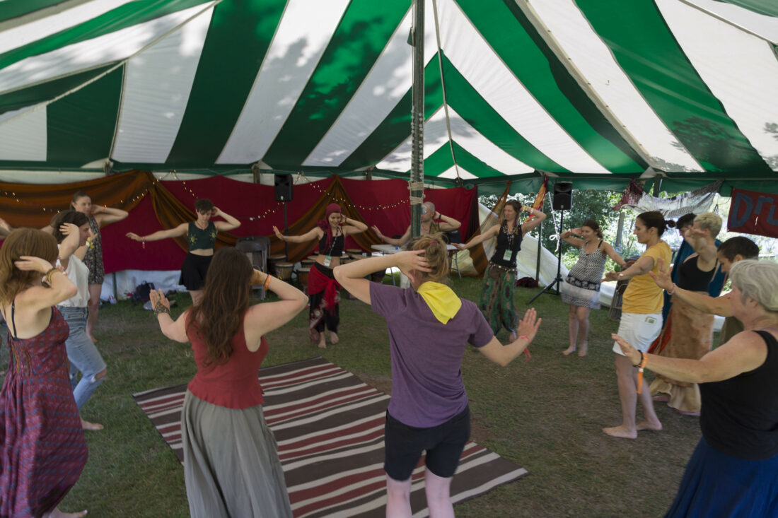 Patrons dancing in the Drum and Dance tent